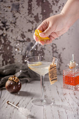 Cocktail and mixology. Glass of сocktail. Hand of barman.