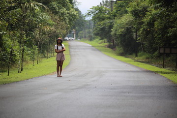 A woman standing on the street in Chanthaburi, Thailand