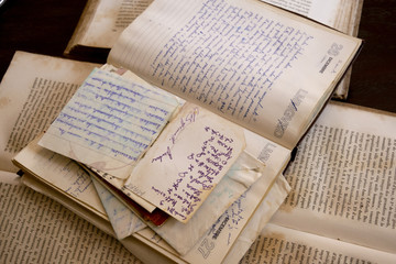 handwrittend papers and antique books