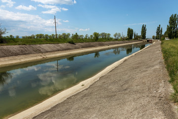 Crimea, Russia, 2014: Rice irrigation canal after fresh water inflow plate from mainland Ukraine....