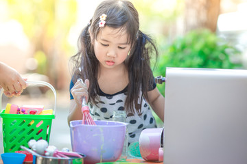 A close-up of the baby's background view, dress-up fashion style, love for childhood, practice playing, have fun with cooking, modeling during the summer school holidays.