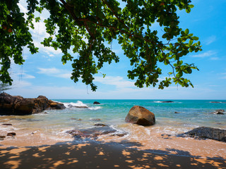 View of uninhabited tropical beach from the shade