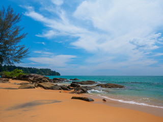 Uninhabited tropical beach with blue sky