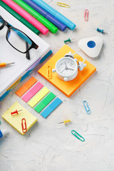 Stationery for school and creative work are on a gray background.