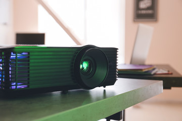 Video projector on table in conference hall, closeup