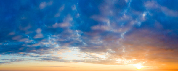 Naklejka na ściany i meble Natural background of the colorful panorama sky. Beautiful cloud in the sunrise sky background. Sky banners background.