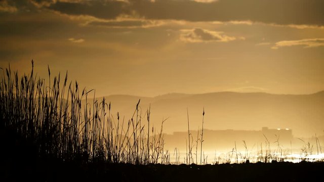 Dark clouds at sunset over sea beach. Nature, coastal landscape. Capi Corb, Mediterranean coast of Spain