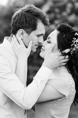 a guy and a girl walk in the spring garden of lilacs