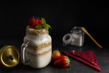 Vegetarian breakfast of yogurt with strawberry and muesli