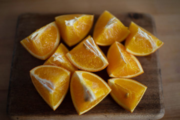 juicy beautiful slices of oranges on a wooden board