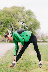 The guy does a warm-up before running in the stadium