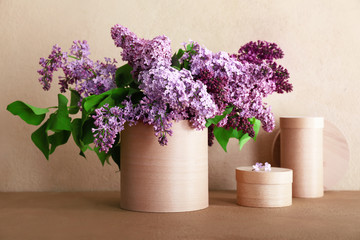 Bouquet of beautiful lilac flowers on table