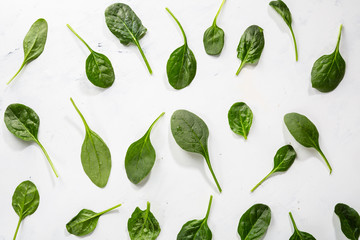 Green spinach pattern food on light surface