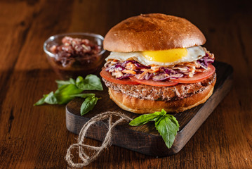 tasty burger with fried egg and beef