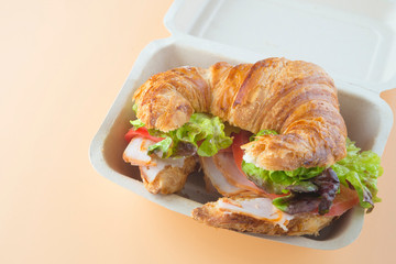 Sandwich of croissant of lettuce, tomato and smoked turkey