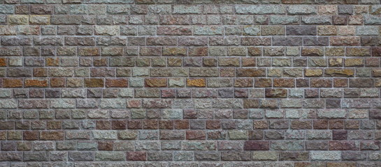 Rough rough surface of the wall with imitation of masonry