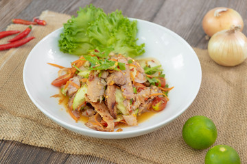 Spicy Sliced Beef Salad, Thai style - wooden background with copy space
