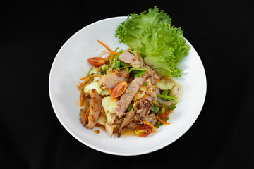 Spicy Sliced Beef Salad, Thai style - black background.