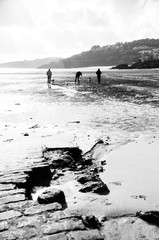 Tourists walking along the bear in St Ives, Cornwall