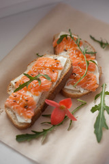 sandwich with red fish and arugula. Quick breakfast. Healthy Nutrition and Vitamins, Coffee and tea