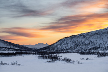 Fototapeta na wymiar warm sunset during cold winter in norway