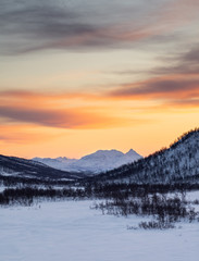 warm sunset during cold winter in norway