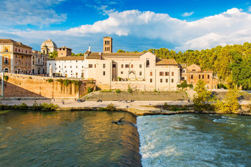 Fototapeta na wymiar Beautiful river Tiber and stone bridge view in Rome. Rome is a famous tourist destination