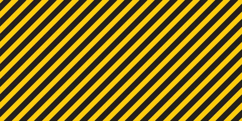 Selbstklebende Fototapeten Black yellow stripes wall Hazard industrial striped road warning Yellow black diagonal stripes Seamless pattern Vector © Tani Kuzminka