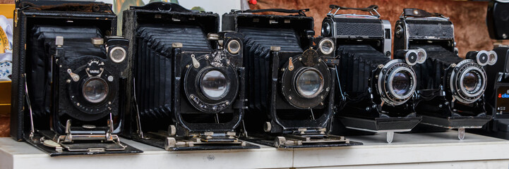 Moscow, Russia, February 2020. Selling vintage cameras at a flea market close-up. - Powered by Adobe