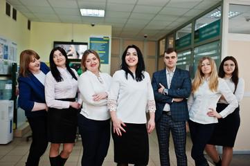 Portrait of young business people group of bank workers in modern office.