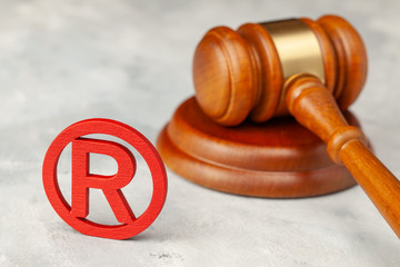 Judge gavel and red trademark sign
