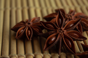 spice star anise in good quality on a bamboo mat with free space for inscription and description