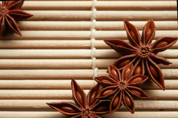 spice star anise in good quality on a bamboo mat with free space for inscription and description