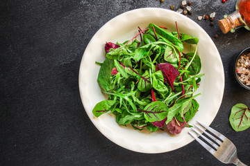 Healthy salad, leaves mix salad (mix micro greens, juicy snack) keto or paleo menu recipe. food background, copy space for text