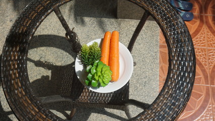 Carrots on the table glass