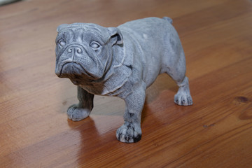 Fototapeta na wymiar a statuette of an English bulldog in a pose for reference