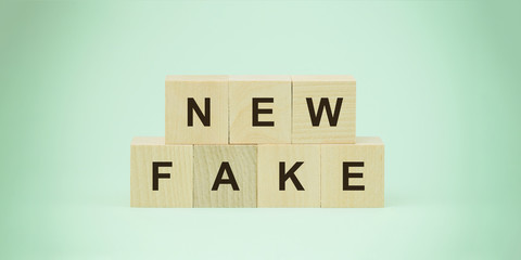 new fake words on wooden blocks social media problems concept
