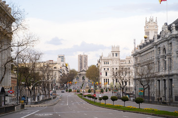 COVID-19 Madrid during shutdown. Image of Empty street and Cibeles Fountain in city center.  