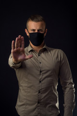 Obraz premium Stop coronavirus. Work at home. Man in black mask