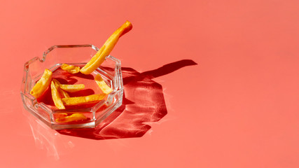 Bowl with unhealthy snack. Junk food, Stop smoking.