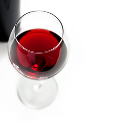 Glasses of red wine on white background.