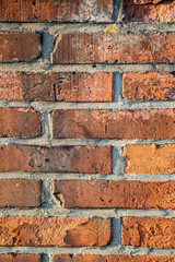 Detail vertical shot of old red brick wall