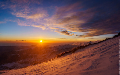 Fototapeta na wymiar sunrise over the mountains winter Elbrus mountain landscape