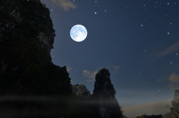 Fototapeta na wymiar Beautiful full moon over high mountain