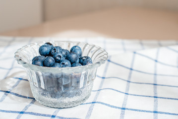 Fresh blueberry in a glass cup. Concept of healthy and dieting eating.