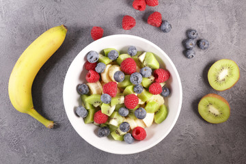 fruit salad with raspberry, blueberry, banana and kiwi