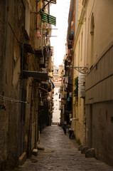 Fototapeta na wymiar Naples / Italy - March 10, 2020: Empty street in Naples, one day after the lockdown in Italy. 