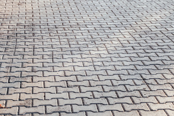 Perspective View Monotone Gray Brick Stone Pavement on The Ground for Street Road. Sidewalk, Driveway, Pavers, Pavement in Vintage Design Ground Flooring Square Pattern Texture Background for mock up