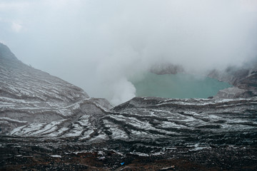 Photo of smoke volcano crater on Java island