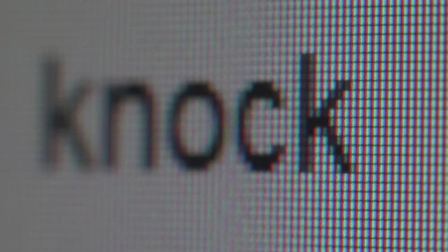 Macro view of typing and erasing phrase knock knock